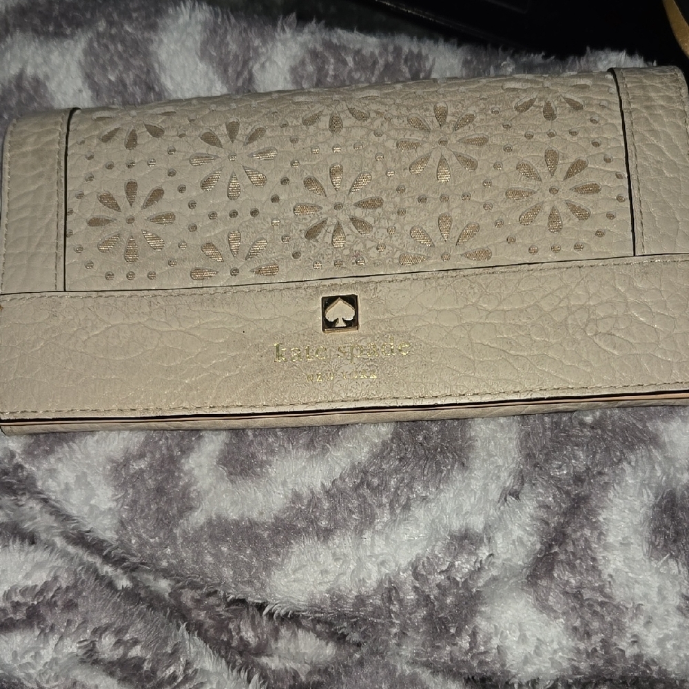 Kate Spade Cream Wallet with Intricate Floral Cutout Design